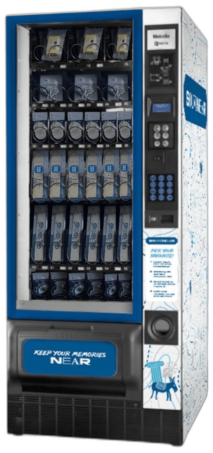 The SouveNear vending machine, wrapped in the brand's travel-map pattern, stocked with local souvenirs